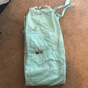 Koi teal scrub pants